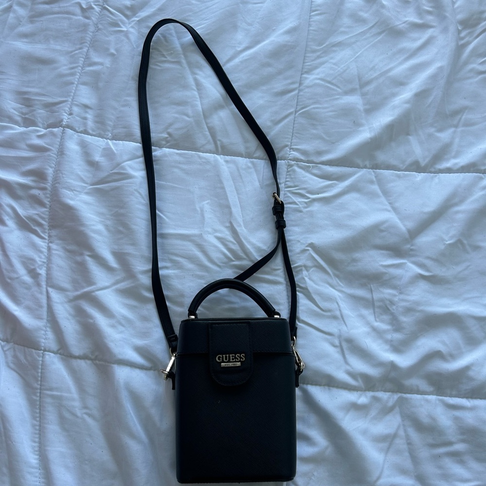Black Guess top handle purse with adjustable side strap